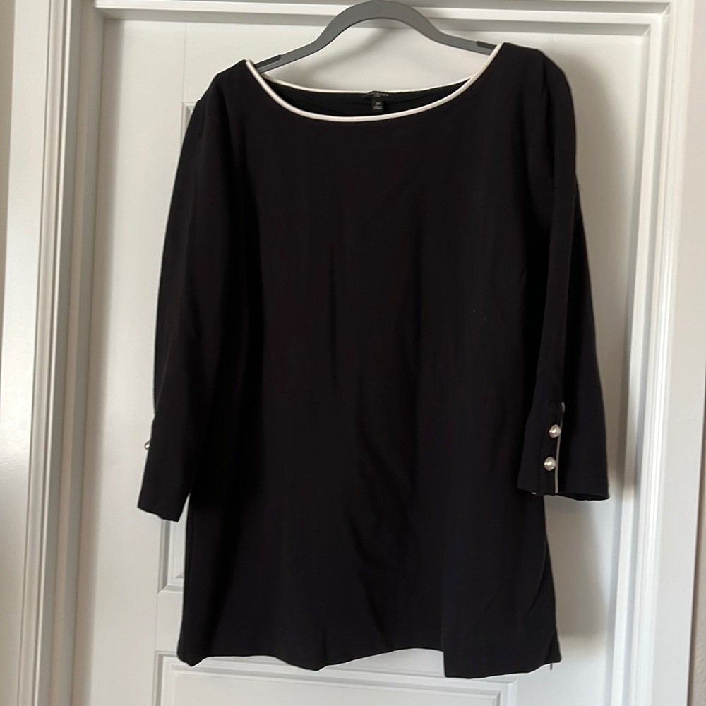 Black shirt with white accents